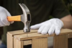 side-view-hand-holding-hammer (1)